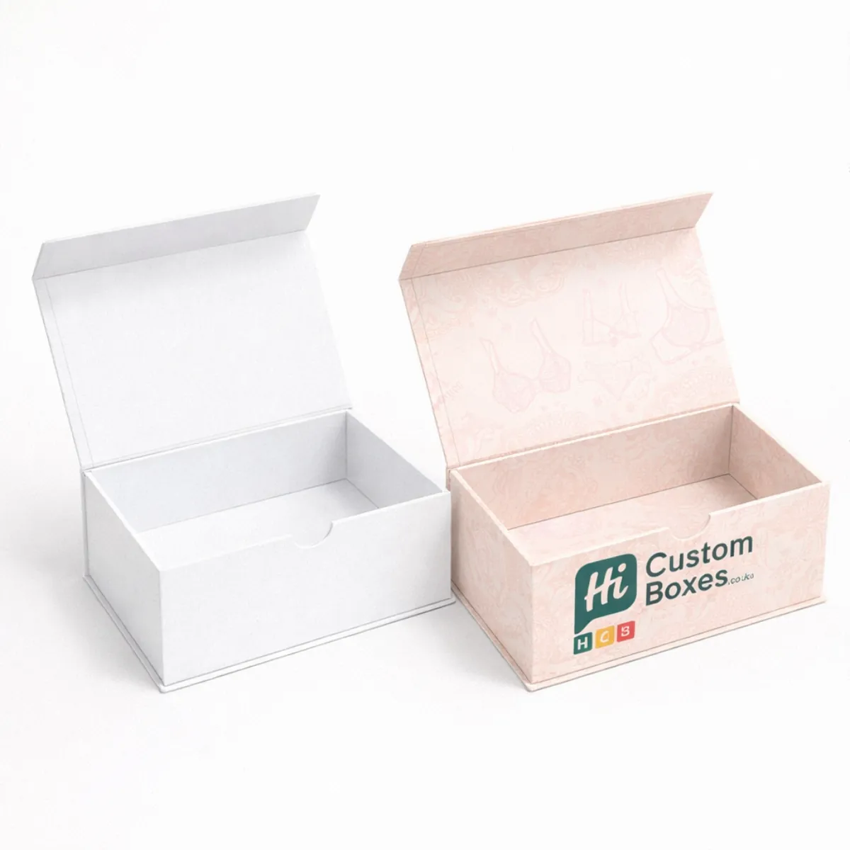 Open luxury magnetic gift boxes shown in white and pink with a delicate lingerie illustration- class=